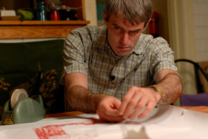 Marty (Lee Mason) repairs his map