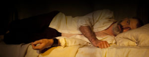 Raskolnikov lies on his bed